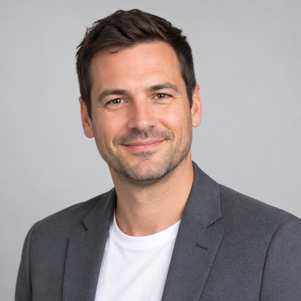 Studio portrait of a young Belgian businessman smiling